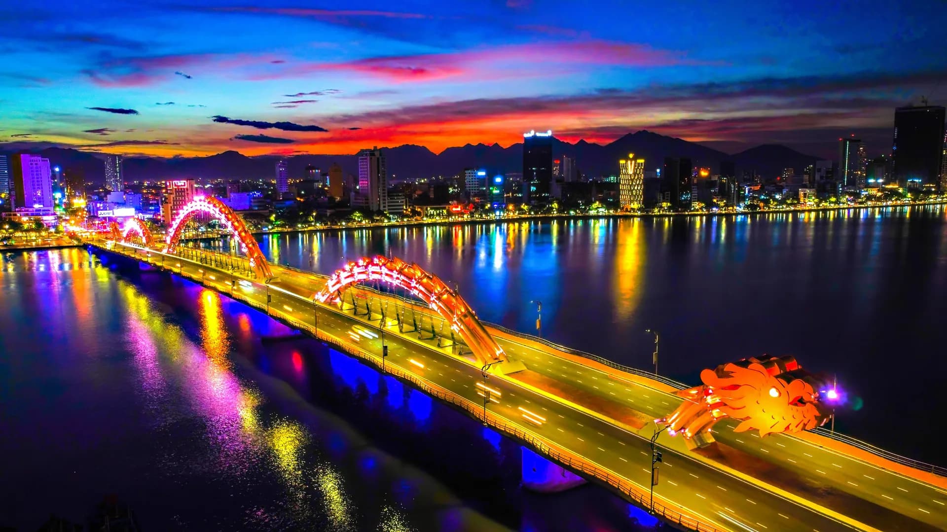 The Dragon Bridge lit up over the Han River in Da Nang